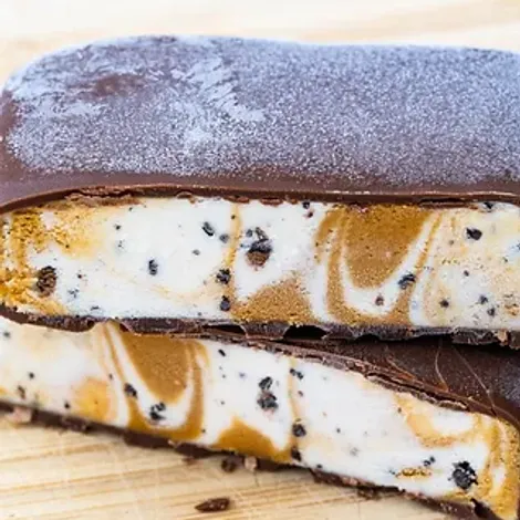 Chocolate Covered Ice Cream Sandwich with Salted Caramel and Vanilla on Wooden Board_.webp